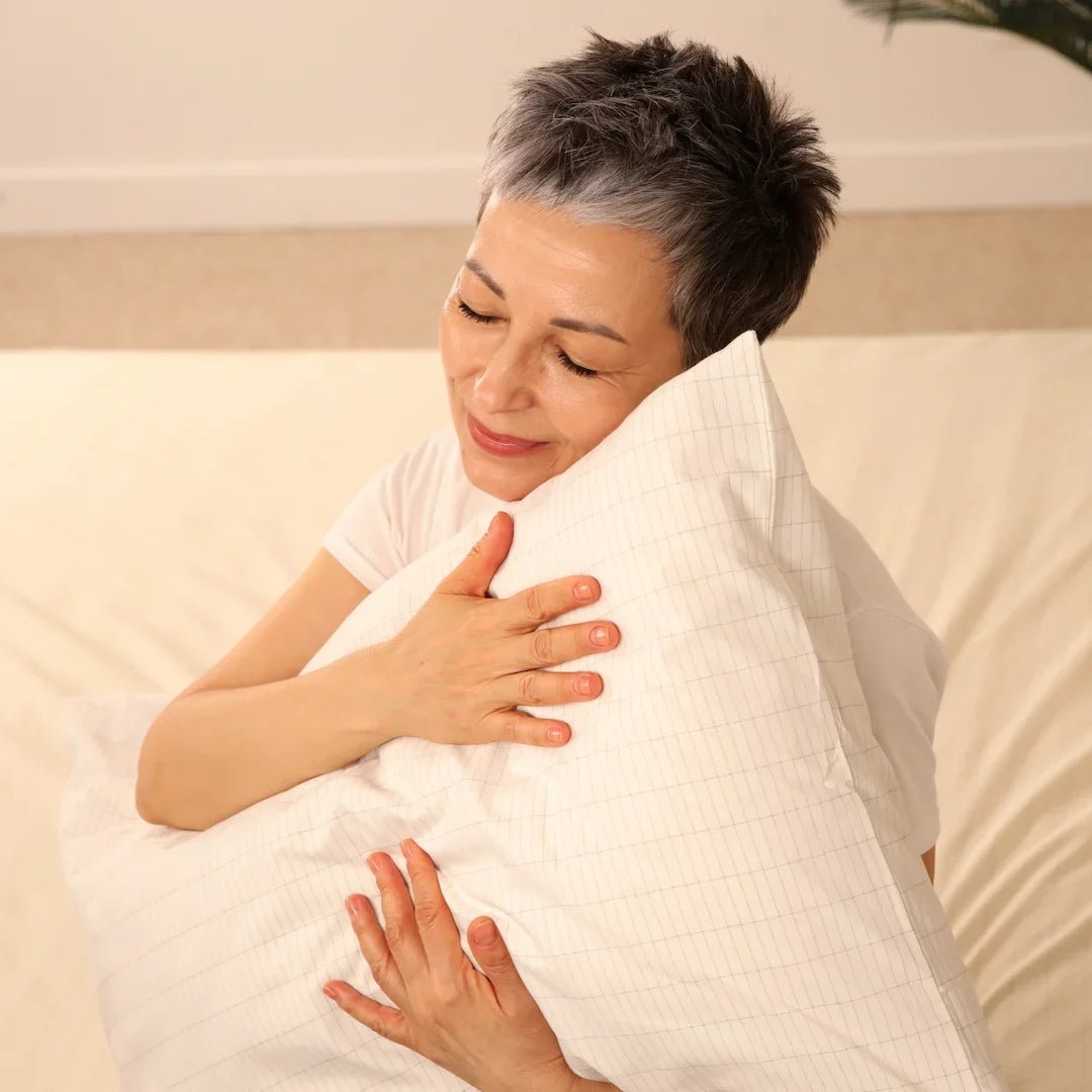 woman-touching-soft-organic-cotton-earthing-harmony-grounding-pillowcases.jpg